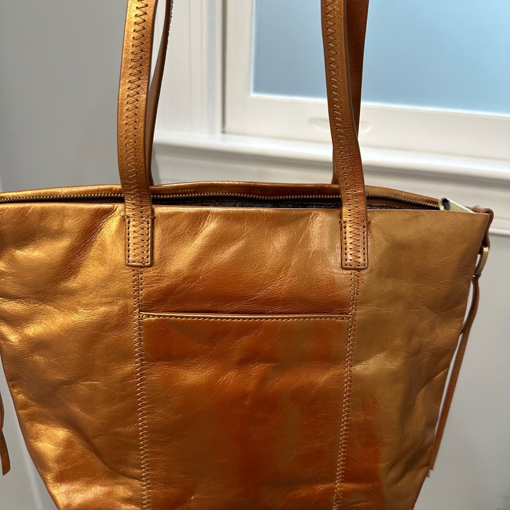This is a copper metallic HOBO Tote (I think style is Cecily ???) used once